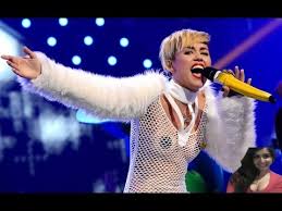 Miley Cyrus performs in see through shirt and pasties at ...