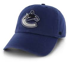While now synonymous with names like linden, bure, and overshadowed by the loud colours and bold design of the uniforms, the new canucks logo was first found on the arms of the infamous 'flying v' jerseys. Men S 47 Blue Vancouver Canucks Clean Up Adjustable Hat