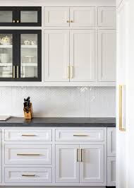 Maybe you would like to learn more about one of these? White Cabinets With Black Frame Glass Doors Transitional Kitchen