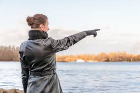 Find photos of woman pointing. Indivstock
