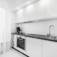 modern, white kitchen with black