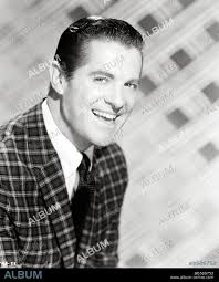 ROBERT CUMMINGS in PROMISE HER ANYTHING, 1965, directed by ARTHUR HILLER.  Copyright PARAMOUNT PICTURES.