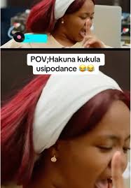 Lady Singing Gospel Song in The Kitchen