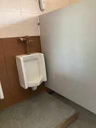 How to replace urinals with a stand-up shower and move a sink in a basement  with no floor drain in North Webster, Indiana?