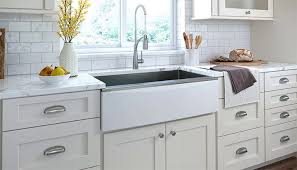 The white cabinetry also draws your eyes upward making white cabinets make the most of natural light in this modern farmhouse kitchen by house of jade interiors. How To Install A Farmhouse Kitchen Sink In 5 Steps Kitchen Cabinet Kings