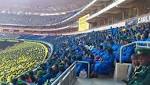 Thousands flock stadium pray against