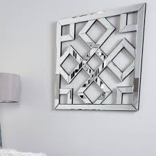 This centerpiece style art is an alluring mix of dark brushed gun metal and natural light wood abstractedly arranged to delight and awe. Diamond Geometric Mirror Wall Art All Home Living