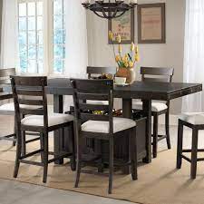 The table rests on a large pedestal loaded with features such as wine bottle storage and storage doors. Elements Colorado Counter Height Dining Set With Built In Storage Royal Furniture Pub Table And Stool Sets