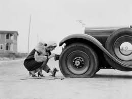 Woman Changing Flat Tire On Car Photographic Print H Armstrong Roberts Allposters Com Flat Tire Car Rental Car