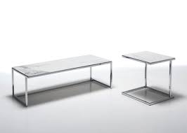 The center support is crafted in polished stainless, and the base is available in a variety of walnut finishes. Coffee Tables With Ceramic Top Idfdesign