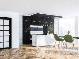 Stunning wooden kitchen flooring with pallet, white cabinet, small wooden rack on the wall to look good in farmhouse kitchen. Loft Kitchen Corner With White Walls A Wooden Floor Black Countertops Stock Photo Picture And Royalty Free Image Image 104236415