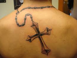 Cross tattoos are among the most versatile tattoo symbols out there today. Back Tattoo Cross With Chain Tutorialchip
