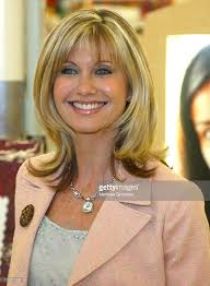 Olivia Newton John Celebrates The Sale Of Her Liv Kit Self Breast  Examintaion Photos and Premium High Res Pictures
