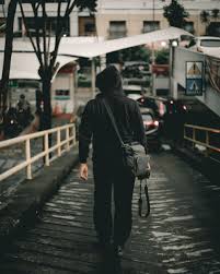 When i need to take a burst, mostly of them seems to be out of focus. Man In Black Hoodie Holding Dslr Camera Walking On Steep Road Photo Free Person Image On Unsplash