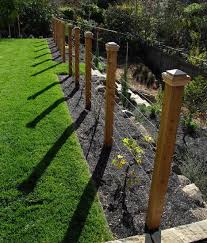 Like This Fence Idea Maybe I D Use Small Gauge Wire At The Bottom And Electrify The First Point Of Wire T Modern Garden Trellis Garden Vines Garden Trellis