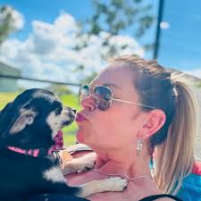 Jenny had a busy day at Tessa's birthday party visiting with my rather loud  family and seeing her rescuer Dawn Weichler again! She did super :0) and  she adores ice cream!