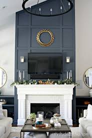The fireplace wall is immediately and entirely the focus of this space, and no other art or décor is even needed. Dramatic Fireplace Wall Makeover Thrifty Decor Chick
