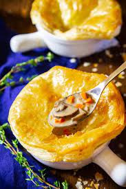 A Close Up Image Of Mushroom Soup In An Oven Safe Bowl With A Baked Puff Pastry Crust On Top And Fresh Thyme I Stuffed Mushrooms Creamed Mushrooms Soup Recipes