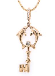 Daisy key pendant in 18k rose gold with a round brilliant diamond. Dolphin Diamond Key Pendant
