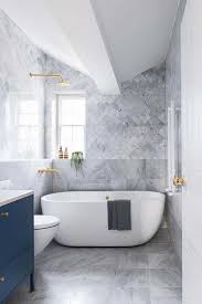 Gray tile is common and affordable, and the quartz countertop also saves money compared to marble or granite. Homedecor Interiors Bathroomideas Modernbathroomsdesign Luxury Bathroom Master Baths Top Bathroom Design Bathroom Interior Design