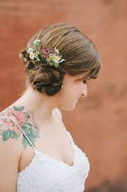 Minneapolis Wedding From Jeff Loves Jessica Brides With Tattoos Side Chignon Flowers In Hair