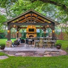An outdoor kitchen with a patio cover will usually start in the $40,000.00+ range. 75 Beautiful Rustic Outdoor Kitchen Design Houzz Pictures Ideas August 2021 Houzz