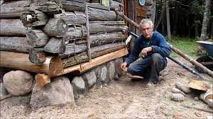 The house to the right shows a more traditional style structure. Martin S Old Off Grid Log Cabin 19 Putting A Rock Foundation Under The Old Cabin Youtube
