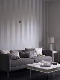 A silver and white color scheme brings to mind visions of a bright winter's day. Stripe By Albany Grey White Wallpaper Direct Minimalist Living Room Living Room White Trendy Living Rooms