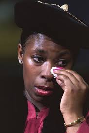 Commencement speaker Donna Harris-Lewis wiping away tears
