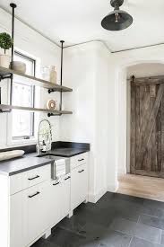 white and tan kitchen pantry with slate