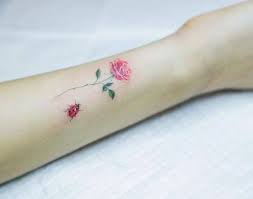 Discover the best tattoo artists specialized in flower art. Wrist Small Pink Rose Tattoo Novocom Top