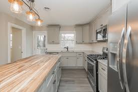 Gray Cabinets With Butcher Block And Granite Counter Tops Mixed Metal Lighting Kitchen Redesign Grey Cabinets Condo Kitchen