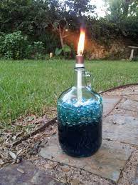 Pin By Meredith Searls On Do It Yourself Wine Bottle Tiki Torch Diy Wine Bottle Tiki Torch Tiki Torches