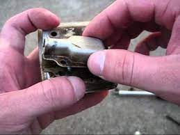 Remove the screws holding the muffler and shielding in place with a screwdriver. How To Clean A Spark Arrestor Screen Youtube