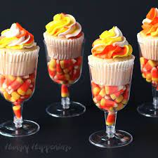 Candy Corn Cupcakes Served In Candy Filled Wine Glasses Recipe Halloween Dessert Table Candy Corn Cupcakes Halloween Food Cupcakes
