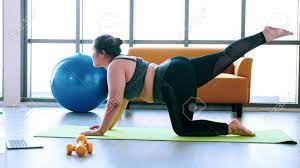 Two asian trainer man and overweight woman exercising stretch together in modern gym, happy and smile during workout. Chubby Woman Doing Exercise By Stretching At Fitness Room Stock Photo Picture And Royalty Free Image Image 141349871
