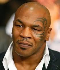 Tattoos All Over His Well Toned Body His Face Tattoo With A Tribal Mike Tyson Mike Tyson Memes Boxing Champions