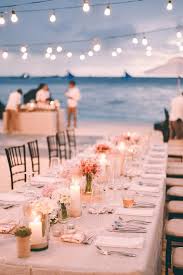 Destination Wedding At The Beach With Outdoor Wedding Reception And Beautiful Wedding Lighti Beach Wedding Tables Boho Beach Wedding Beach Wedding Centerpieces