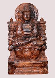 Golden colored buddha face on dark tile background, handmade wood carving bali style. Buy Wooden Sculptures Online Wood Carving Online Wooden Statue Online Wooden Sculpture Wooden Statues Statue