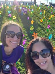 Supporting Alzheimer's causes with different colored flowers