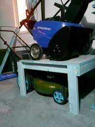 Lawn Mower Snowblower Storage A Great Way To Make Some Floor Space When Not Using Your Snowblo Snowblower Storage Garage Organization Garage Storage Solutions