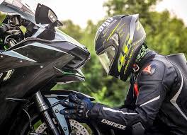 Hd Wallpaper Person Wearing Helmet While Holding Motorcycle Man Wearing Black Helmet Holding Motorcycle Wallpaper Flare Rider riding green motocross dirt bike, action, bike rider, biker. person wearing helmet while holding