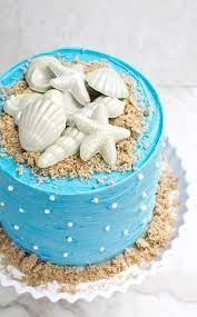 Learn how to make flowers out of tubed icing, magnificent umbrellas out of kraft candy melts, an ocean out of butter cream icing, the shore out of granulated. How To Make A Beach Themed Cake Beach Cakes Easy Beach Cake Ocean Cakes