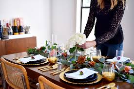 Happy thanksgiving table setting with white vintage style plates, gold silverware, and. A Modern Thanksgiving Tablescape Fashion Jackson