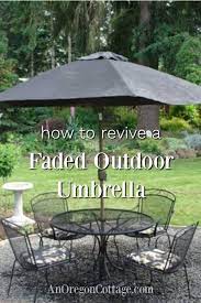 Original umbrella hole protector was plastic that hardened with age. How To Paint A Faded Outdoor Umbrella Updates On How It Lasted An Oregon Cottage