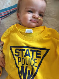 Yesterday, Major Michael Devlin, Troop "B" Commander, Captain James Ryan,  and a contingent of troopers visited Hackensack University Medical Center  and delivered presents in the form of, NJSP gear, and other toys