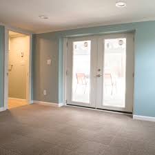 Carpet is warm and soft, which makes it much cozier feeling than a cold and hard most people do not even realize that carpet can be added to a basement. Basement Carpeting Tiles Total Basement Finishing
