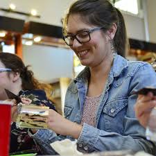 Community members create candles for a cause