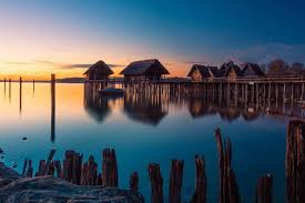 Reflective scenes bring out the creativity in a photographer, sometimes offering vast improvements in a rather mundane view. Pfahlbaumuseum Unteruhldingen World Cultural Heritage On Lake Constance