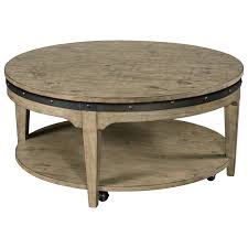 The object stands on small casters, which for sure facilitates its movement around the space. Plank Road Artisans Round Solid Wood Cocktail Table With Hidden Casters Stoney Creek Furniture Cocktail Coffee Tables